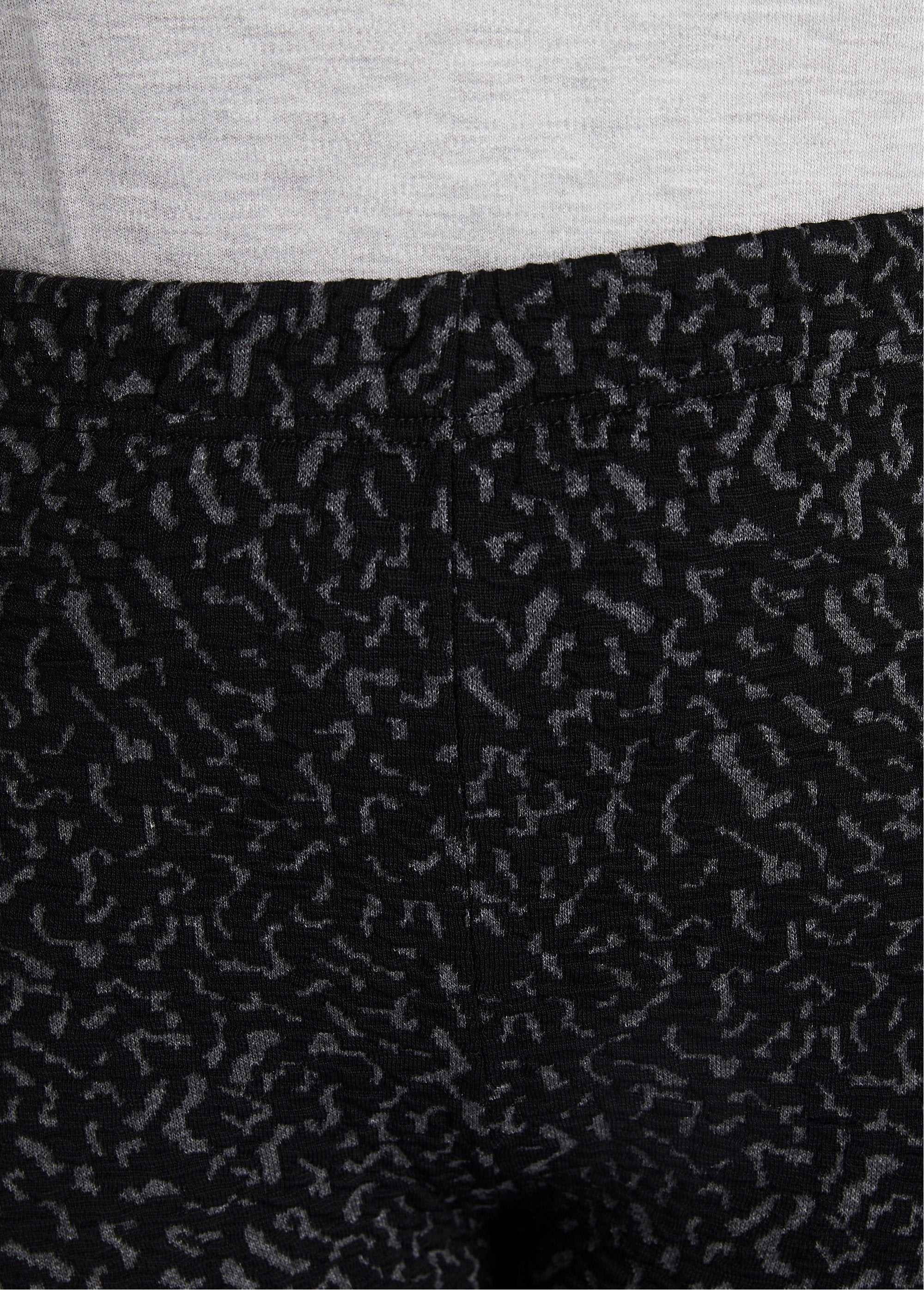 Leggings_elásticos_lisos_o_bicolores_con_cintura_elástica_gris_y_negro_DE2_curvy